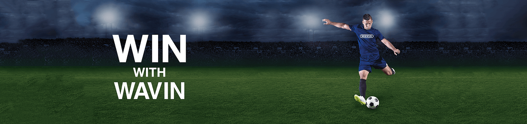 Football player kicking football on a field - low resolution v3