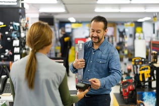 Man buying at counter at hardware store